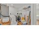Efficient laundry room with shelving and storage space at 900 Lake Jessie Dr, Winter Haven, FL 33881