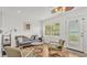 Comfortable living room with lake views and comfortable seating arrangement at 900 Lake Jessie Dr, Winter Haven, FL 33881