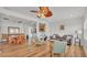 Bright, open-concept living room with a dining area, hardwood floors, and modern decor at 900 Lake Jessie Dr, Winter Haven, FL 33881