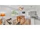 Bright living space with hardwood floors, a sofa, and a foosball table for entertaining at 900 Lake Jessie Dr, Winter Haven, FL 33881