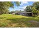 Expansive backyard with lush green lawn offers ample space for outdoor activities and entertainment at 1003 Bear Lake Rd, Apopka, FL 32703