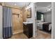 Bathroom with tiled shower and a view into the main bedroom at 1003 Bear Lake Rd, Apopka, FL 32703