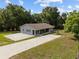 Charming single-story home with a spacious driveway and well-maintained lawn at 1003 Bear Lake Rd, Apopka, FL 32703