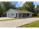 A lovely single-story home featuring a spacious driveway, covered porch, and well-manicured landscape at 1003 Bear Lake Rd, Apopka, FL 32703