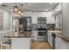 Updated kitchen featuring stainless steel appliances and stylish backsplash at 1003 Bear Lake Rd, Apopka, FL 32703