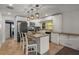 Bright kitchen with modern appliances, island, and pendant lighting at 1003 Bear Lake Rd, Apopka, FL 32703