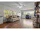 Bright living room with hardwood floors, a comfortable sofa, and lots of natural light at 1003 Bear Lake Rd, Apopka, FL 32703