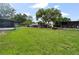 Expansive backyard with dog kennels and several outbuildings at 105 Leslie Ave, Winter Haven, FL 33880