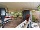 Carport with a boat, storage shed, and brick flooring at 105 Leslie Ave, Winter Haven, FL 33880