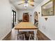Charming dining room features a vintage hutch, wood table, and sliding glass doors at 105 Leslie Ave, Winter Haven, FL 33880