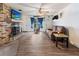 Comfortable living room with a cozy fireplace and hardwood floors creating a warm atmosphere at 105 Leslie Ave, Winter Haven, FL 33880