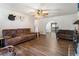 Open-concept living room with hardwood floors and an arched doorway, perfect for entertaining guests at 105 Leslie Ave, Winter Haven, FL 33880