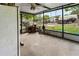 Enclosed patio with ceiling fan, and outdoor views of the yard at 105 Leslie Ave, Winter Haven, FL 33880