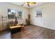 Spacious room features updated floors and three windows bringing in natural light at 105 Leslie Ave, Winter Haven, FL 33880