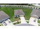 Aerial view of a single-Gathering home with a well-manicured lawn and driveway at 1050 Michelangelo Ln, Winter Haven, FL 33884