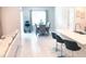 Bright and open dining area with neutral colors, adjacent to modern kitchen at 1050 Michelangelo Ln, Winter Haven, FL 33884