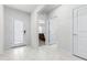 Inviting entryway with tile floors, bright lighting, and a view into the bedroom at 1050 Michelangelo Ln, Winter Haven, FL 33884