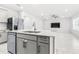 Kitchen area with stainless appliances, breakfast bar and an open view to the living room at 1050 Michelangelo Ln, Winter Haven, FL 33884