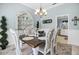 Elegant dining room with classic decor, chandelier, and plenty of room for guests at 109 Lake Mariam Way, Winter Haven, FL 33884