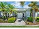 Charming home featuring a manicured front yard, lush landscaping, and inviting entrance at 109 Lake Mariam Way, Winter Haven, FL 33884