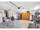 Open garage space featuring built in wooden cabinetry and plenty of room for parking and storage at 109 Lake Mariam Way, Winter Haven, FL 33884