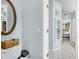 Hallway featuring access to a closet, bathroom, and main bedroom at 109 Lake Mariam Way, Winter Haven, FL 33884