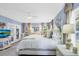 Light blue main bedroom featuring plush carpeting, white furnishings, ceiling fan and deck access at 109 Lake Mariam Way, Winter Haven, FL 33884