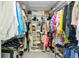Spacious walk-in closet with built-in shelves and rods, providing ample storage at 109 Lake Mariam Way, Winter Haven, FL 33884