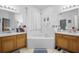 This bathroom offers dual sinks, soaking tub, tile flooring and plenty of counter space at 110 Minniehaha Cir, Haines City, FL 33844