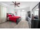 This spacious bedroom offers soft carpet, ceiling fan and a black dresser at 110 Minniehaha Cir, Haines City, FL 33844