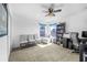 Versatile bonus room with ample natural light, comfortable seating, and functional workspace at 110 Minniehaha Cir, Haines City, FL 33844
