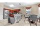 Bright eat-in kitchen features stainless steel appliances, a breakfast bar, and a dining table at 110 Minniehaha Cir, Haines City, FL 33844