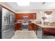 Well-equipped kitchen featuring stainless steel appliances, granite countertops, and ample cabinet space at 110 Minniehaha Cir, Haines City, FL 33844