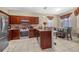 Well-appointed kitchen with stainless steel appliances, granite counters, and breakfast area with dining table at 110 Minniehaha Cir, Haines City, FL 33844