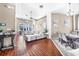 Spacious living room with hardwood floors, modern decor, and plenty of natural light at 110 Minniehaha Cir, Haines City, FL 33844