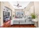 Comfortable living room featuring a large sectional sofa, hardwood floors, and stylish accents at 110 Minniehaha Cir, Haines City, FL 33844