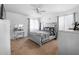 Elegant main bedroom with a plush bed, stylish decor, and ample natural light at 110 Minniehaha Cir, Haines City, FL 33844