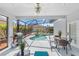 Outdoor patio area featuring an in-ground pool and a grill, perfect for entertaining at 110 Minniehaha Cir, Haines City, FL 33844