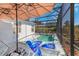 Outdoor pool featuring sun loungers and a relaxing shaded area with clear blue skies above at 110 Minniehaha Cir, Haines City, FL 33844