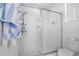 Modern bathroom shower stall with glass enclosure, handheld shower, and toiletry storage at 110 Minniehaha Cir, Haines City, FL 33844