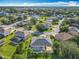 The aerial shot shows the property's screened pool, well-maintained lawn, and its peaceful neighborhood at 123 Evergreen Dr, Auburndale, FL 33823