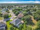 An aerial view reveals the property's proximity to lush green neighborhoods and landscaping at 123 Evergreen Dr, Auburndale, FL 33823