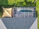 Aerial view showcasing a screened pool and a shaded patio area at 123 Evergreen Dr, Auburndale, FL 33823