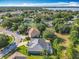 An aerial view shows the layout of a quiet residential neighborhood near a lake at 123 Evergreen Dr, Auburndale, FL 33823