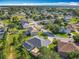 Beautiful aerial view of a neighborhood with mature trees and well-maintained lawns and homes at 123 Evergreen Dr, Auburndale, FL 33823