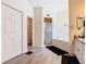 Bright bathroom featuring a tub, shower, and double door closet at 123 Evergreen Dr, Auburndale, FL 33823