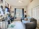 Spacious bedroom with modern decor, a ceiling fan, and a comfortable seating area at 123 Evergreen Dr, Auburndale, FL 33823