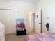 Cozy bedroom with closet and doorway, providing a comfortable and inviting private space at 123 Evergreen Dr, Auburndale, FL 33823