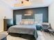 Stylish bedroom with a dark accent wall, modern furniture, and plenty of natural light at 123 Evergreen Dr, Auburndale, FL 33823