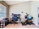 Versatile room with wood-look floors and a large window, perfect for a home office or gym at 123 Evergreen Dr, Auburndale, FL 33823